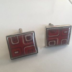 Silver cuff links with red white and black pattern